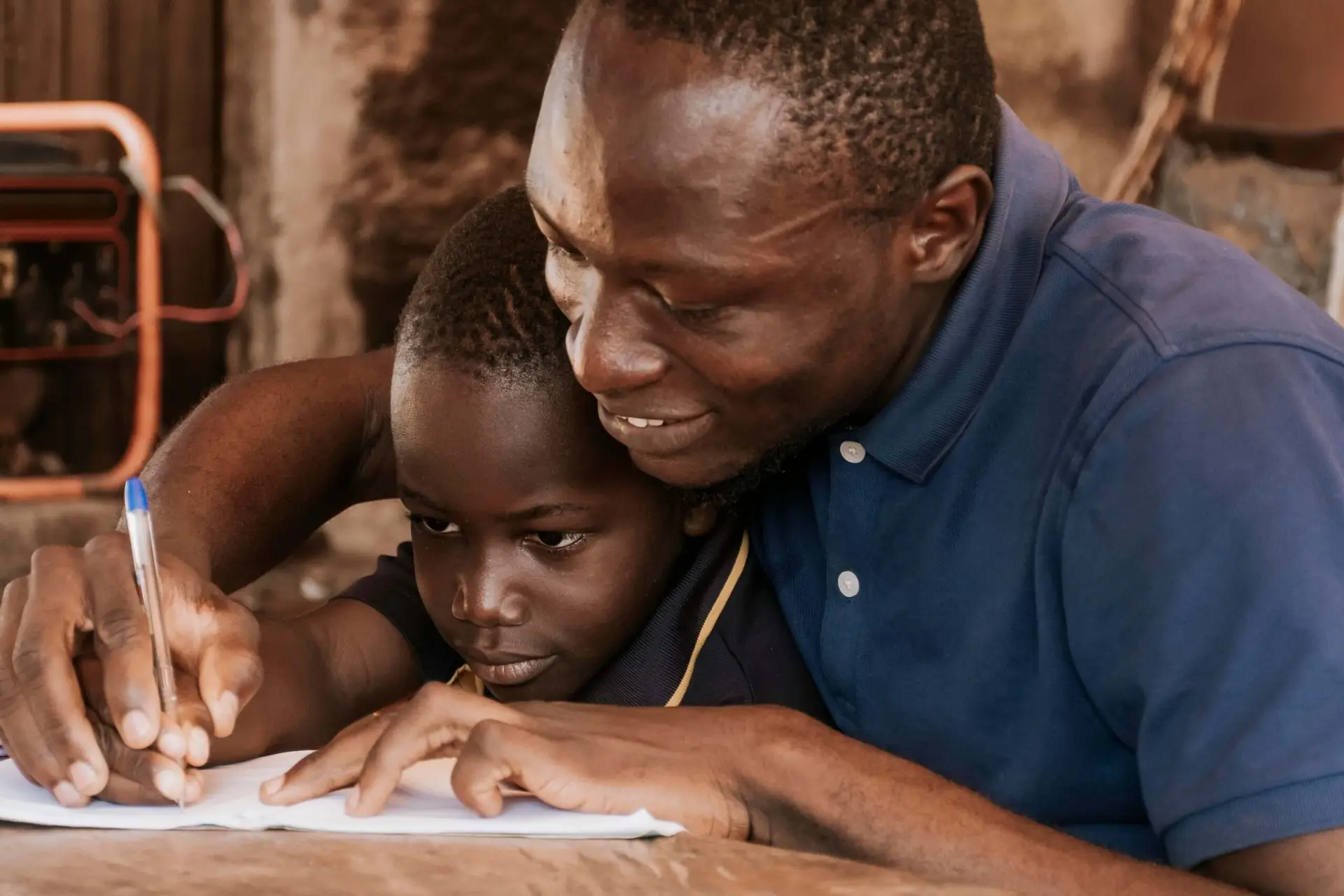 close-up-father-teaching-kid-write (1) (1)